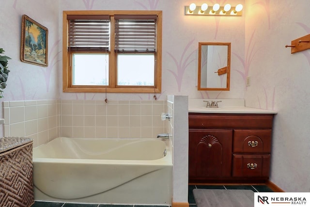 bathroom with tile patterned flooring, vanity, and a tub to relax in