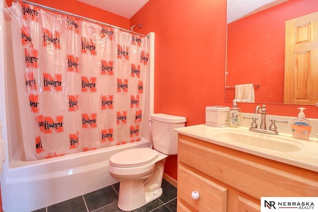 full bathroom with shower / bath combo with shower curtain, tile patterned floors, toilet, and vanity