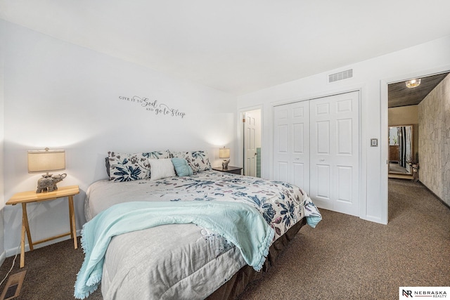 bedroom featuring a closet, visible vents, and carpet