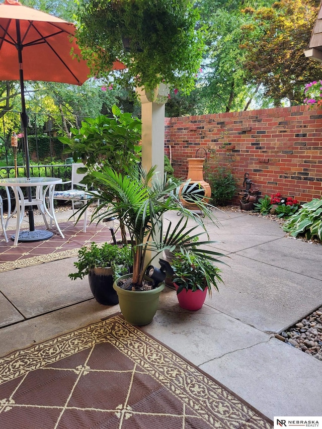 view of patio featuring fence