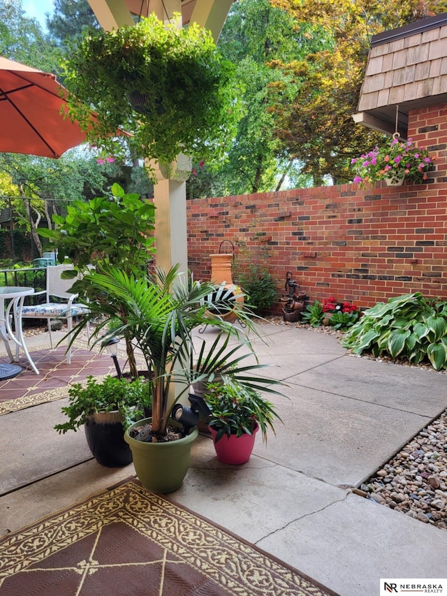 view of patio with fence