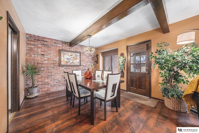 dining area with beam ceiling, dark wood-style floors, a textured ceiling, and baseboards