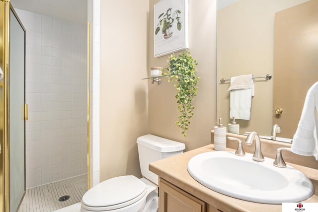 bathroom featuring vanity, walk in shower, and toilet