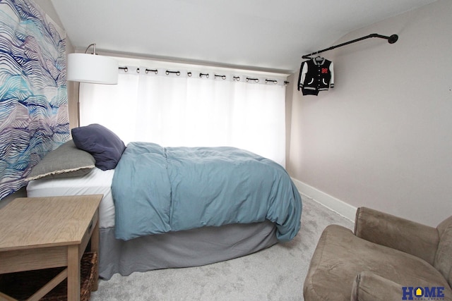 bedroom with light colored carpet