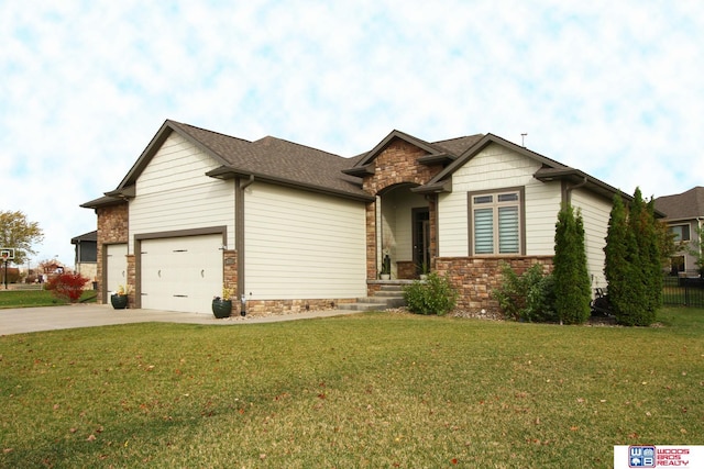 view of front of house featuring a garage and a front yard