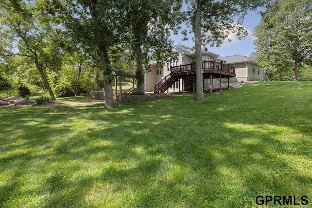 view of yard featuring a wooden deck