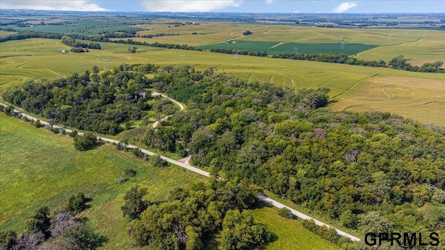 birds eye view of property with a rural view