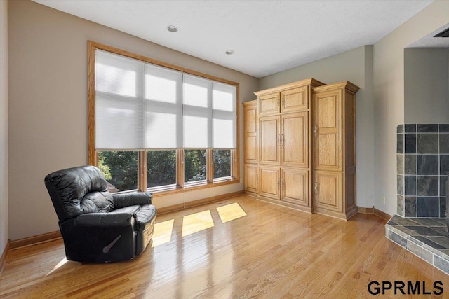 sitting room with light hardwood / wood-style floors