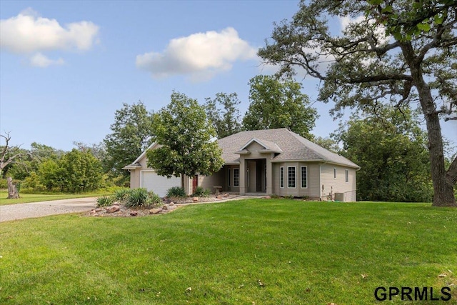 view of front of home featuring a garage and a front yard