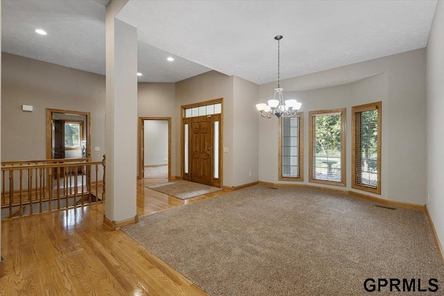 entrance foyer featuring a chandelier and light hardwood / wood-style floors