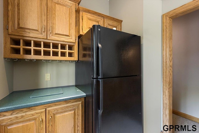 kitchen with black refrigerator