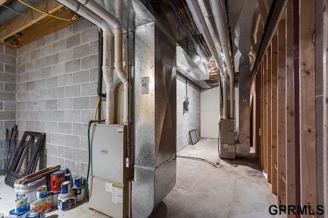 utility room featuring heating unit