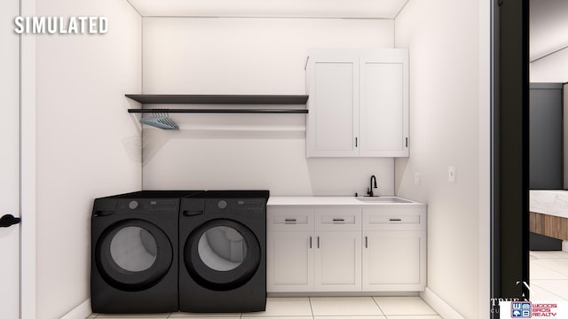 washroom with sink, light tile patterned floors, washing machine and dryer, and cabinets