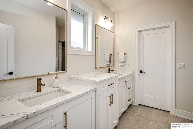 bathroom with tile patterned flooring and vanity