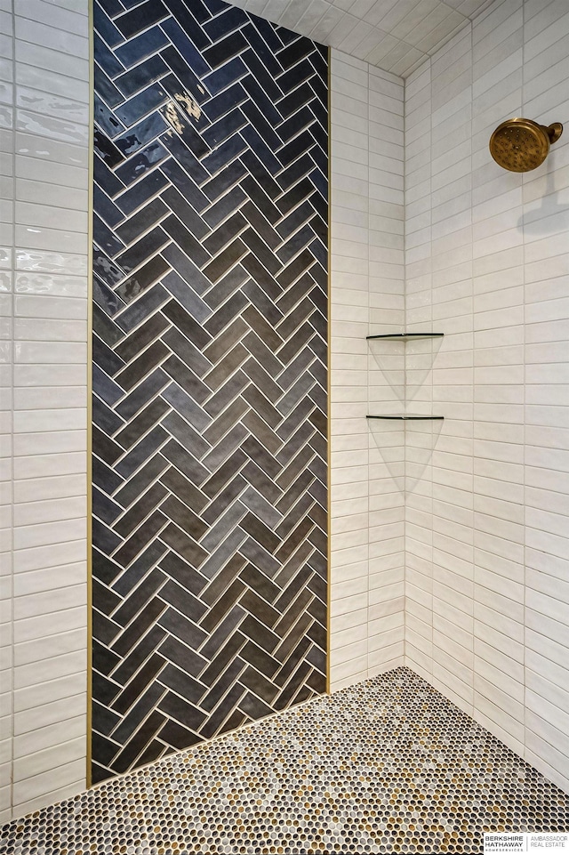 bathroom with tiled shower