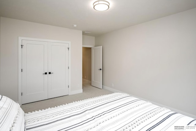 carpeted bedroom with a closet