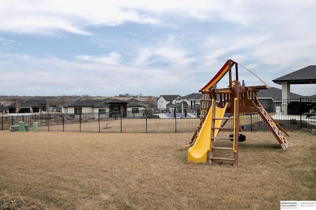 view of jungle gym with a lawn