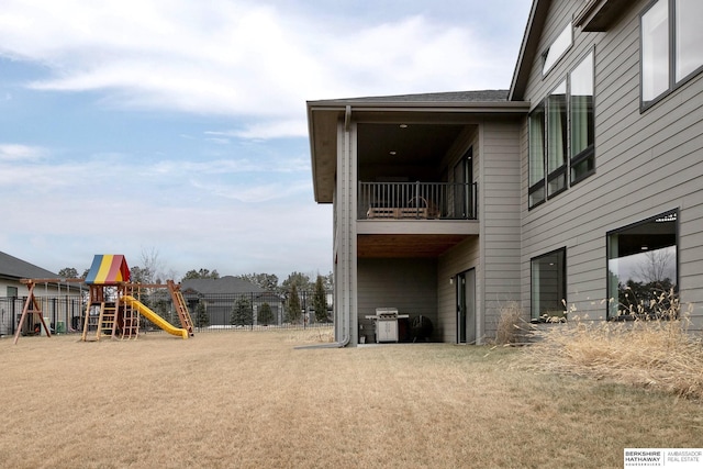 view of property exterior with a playground