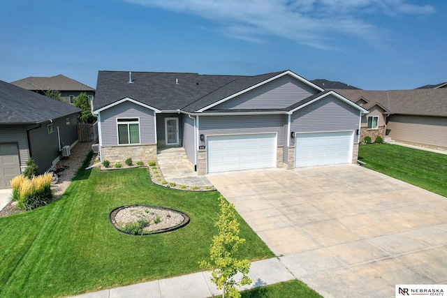 view of front of home featuring a garage and a front lawn