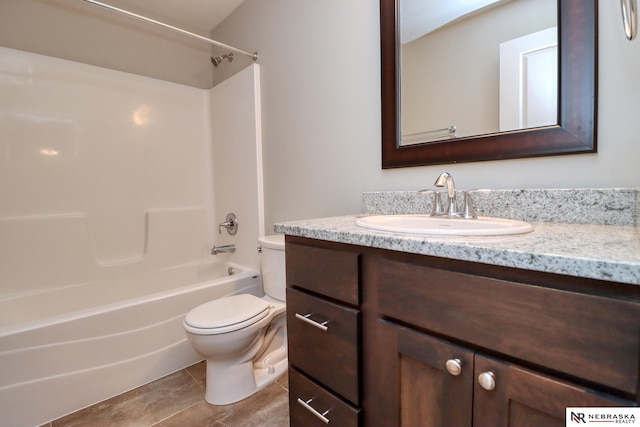 full bathroom featuring vanity, tub / shower combination, and toilet