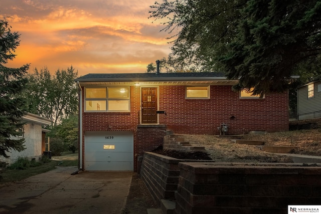 view of front of property with a garage