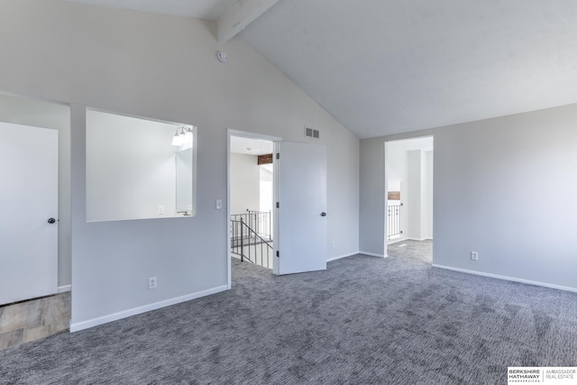 carpeted empty room featuring high vaulted ceiling and beam ceiling