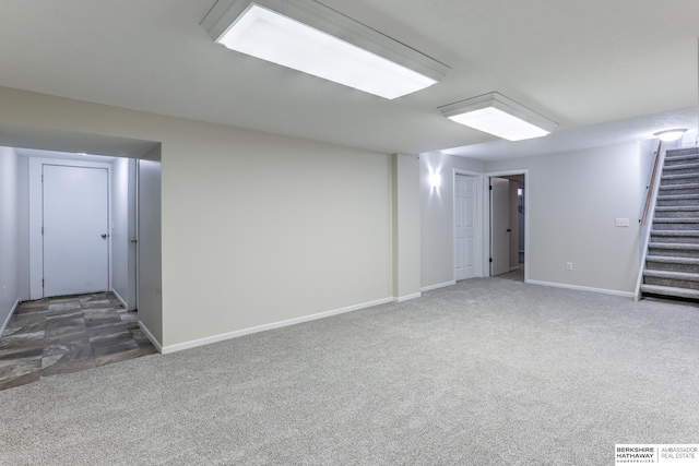 basement with dark colored carpet