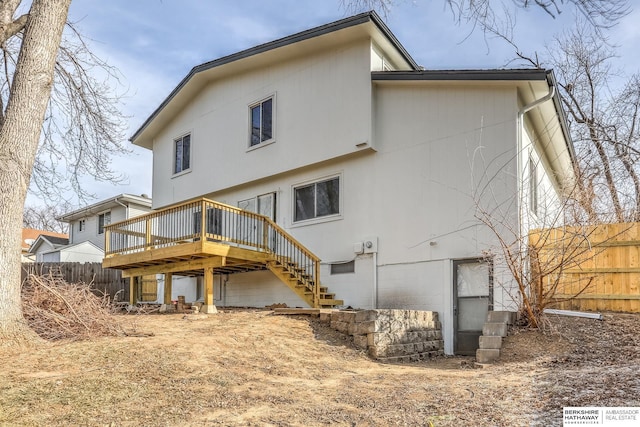 back of house featuring a deck