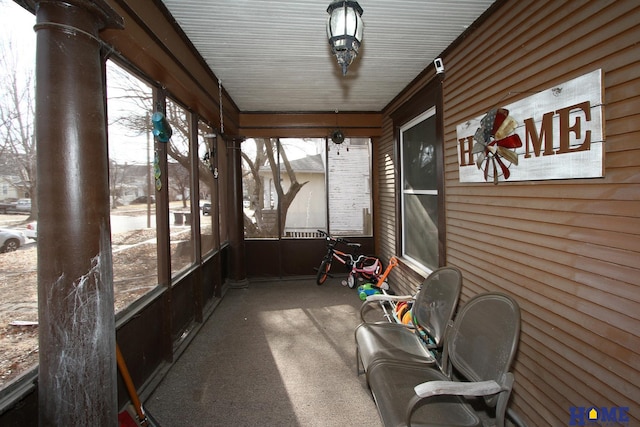 unfurnished sunroom featuring plenty of natural light