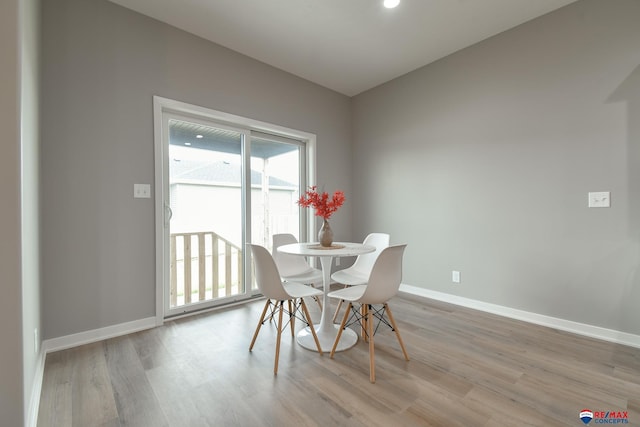 dining space with light wood-type flooring