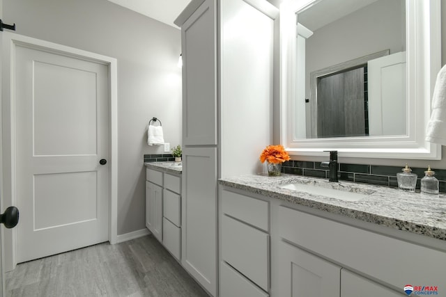 bathroom with wood-type flooring and vanity