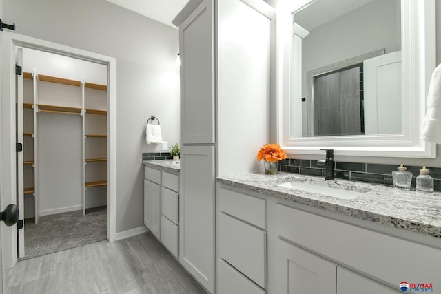 bathroom with vanity and wood-type flooring