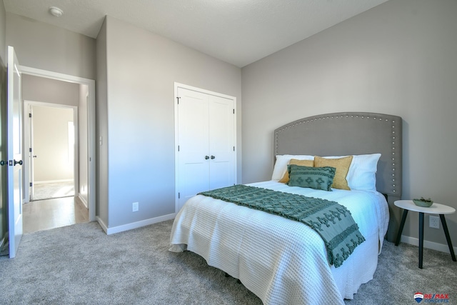 carpeted bedroom featuring a closet