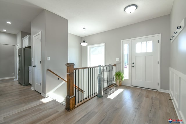 foyer entrance featuring light wood-type flooring