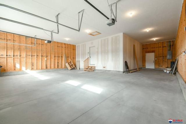 garage featuring a garage door opener and electric panel