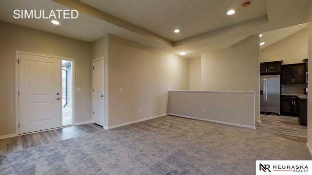 view of carpeted entrance foyer