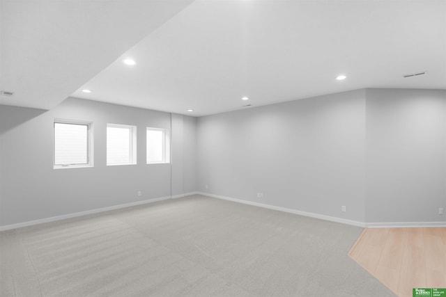 unfurnished room with light carpet