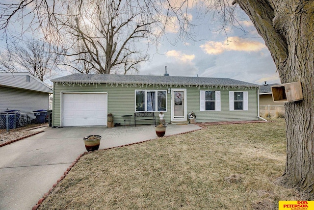 single story home with a garage and a lawn