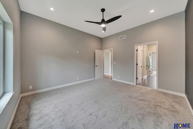 unfurnished bedroom featuring ceiling fan and light colored carpet