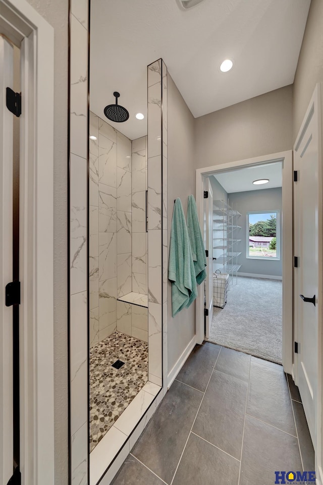 bathroom with tiled shower