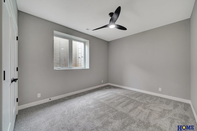 carpeted empty room featuring ceiling fan