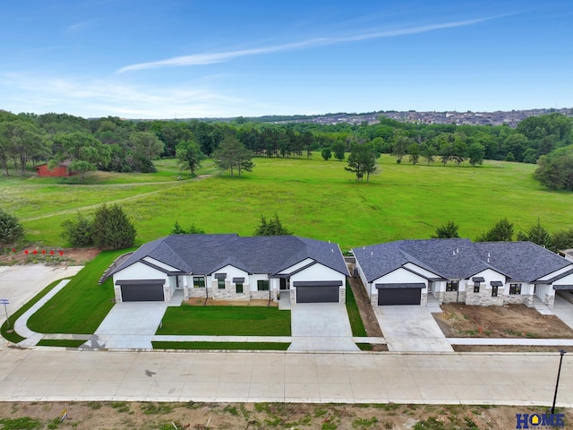 birds eye view of property with a rural view