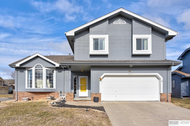 view of front of house featuring a garage and a front lawn