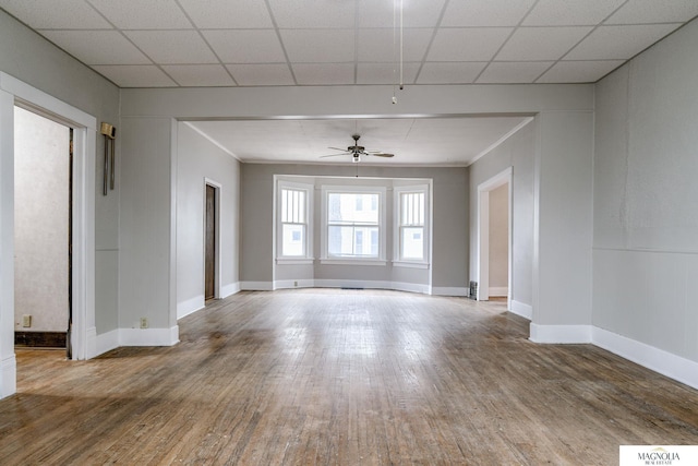 empty room with ceiling fan and wood-type flooring