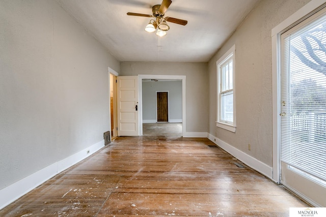 spare room featuring ceiling fan and light wood-type flooring