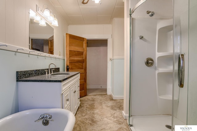 bathroom featuring vanity and separate shower and tub