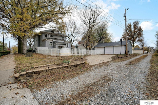 view of yard featuring an outbuilding and a garage