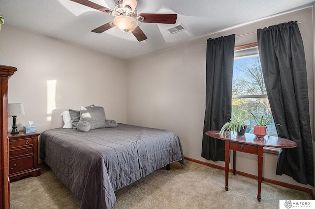 bedroom with light carpet and ceiling fan