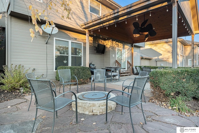 view of patio / terrace featuring a fire pit and ceiling fan