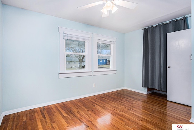 empty room featuring hardwood / wood-style floors and ceiling fan